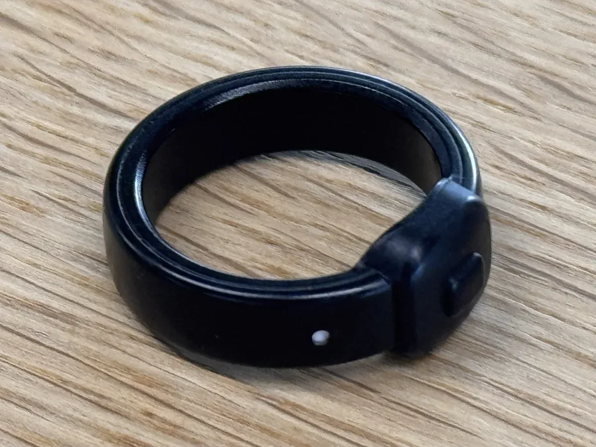 The Index 01 ring resting on a wooden table